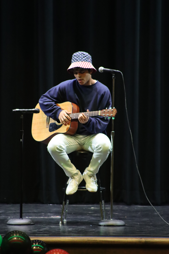 Simeon playing the guitar
