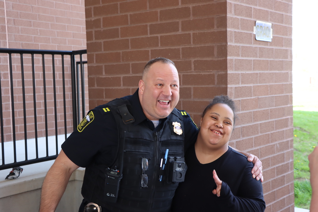 Police Officer and Student posing for a picture